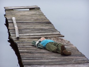 child relaxing laying lying down
